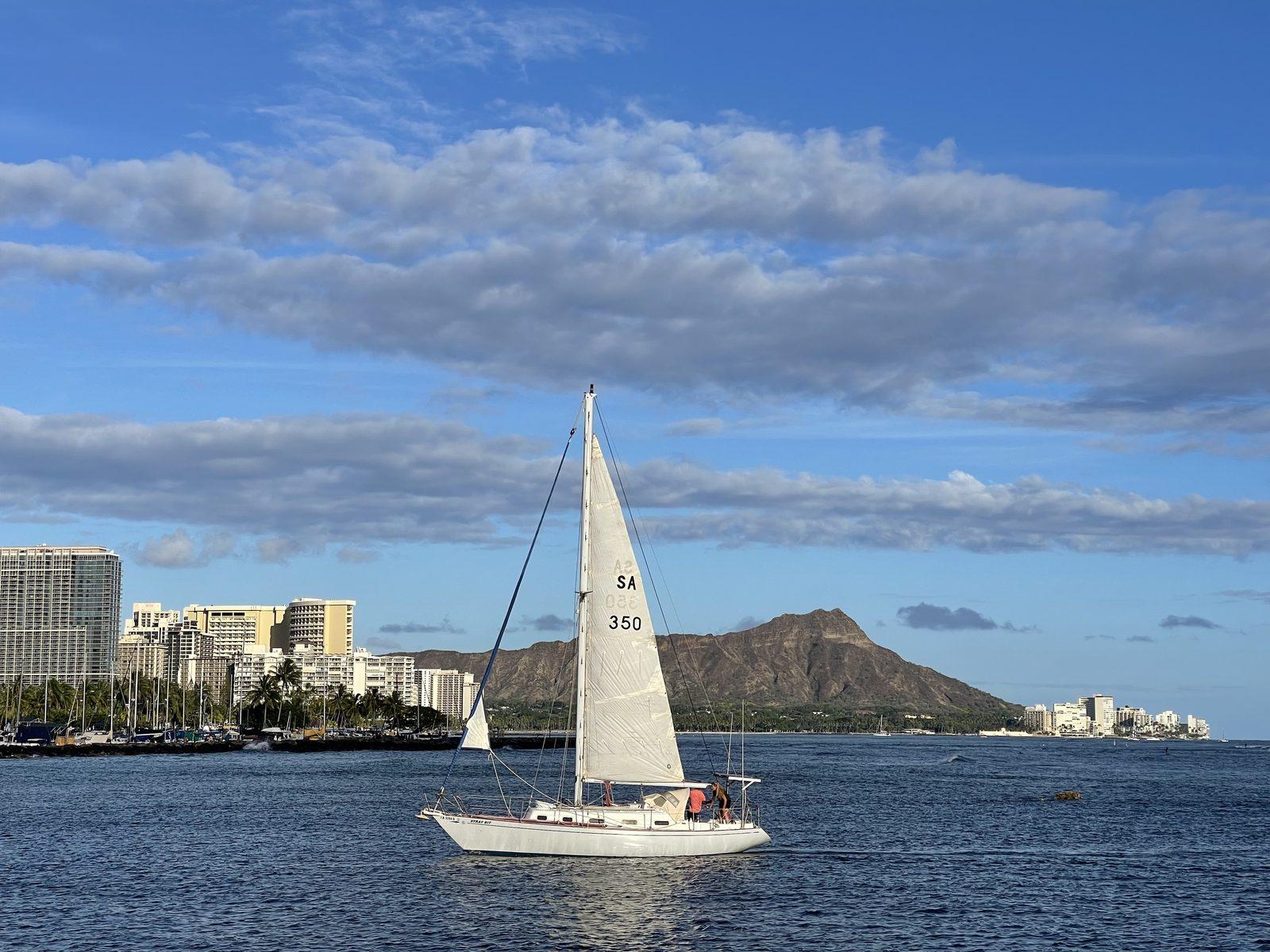 Sailboat passing Diamond Head